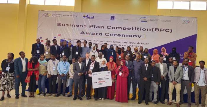 Participants of a business plan competition posing for a group photo