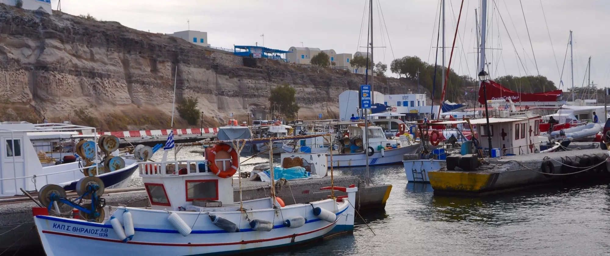 Crowded fishing boats in Vlychada, Santorini