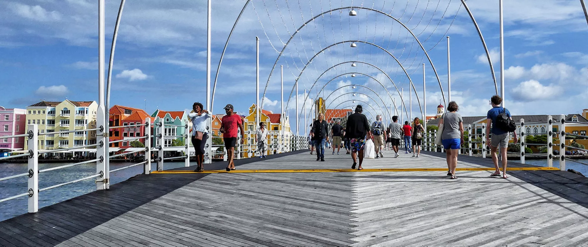 People crossing Curacao foating bridge Emma in Willemstadt, Curacao