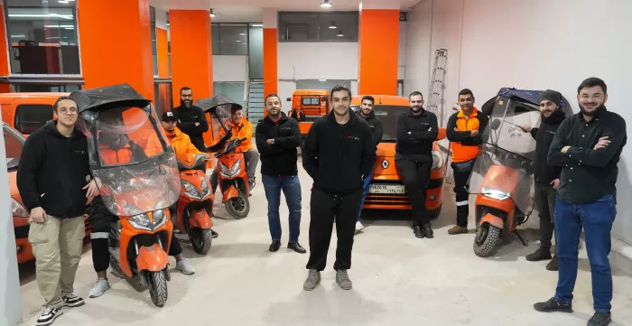 delivery workers posing with their bikes