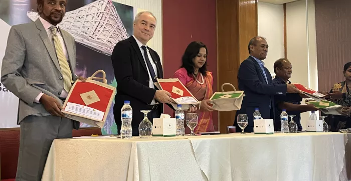 Tea garden workers handing over souvenir to the panellists