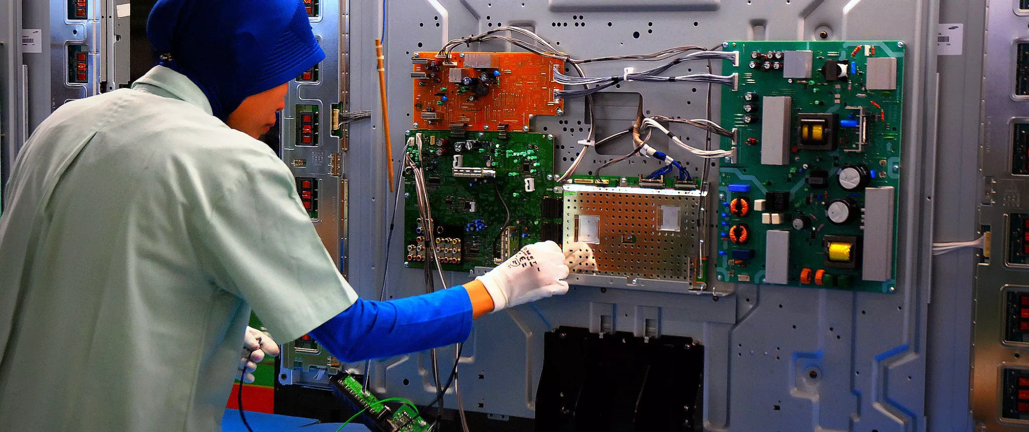 Woman worker on an electronic machinary