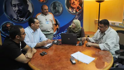 A group discussing at a round table.