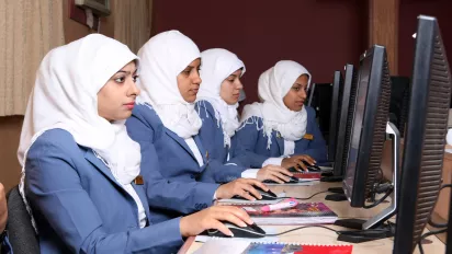 Women following a training on computers